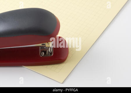 new stapler for stapling papers on a table Stock Photo