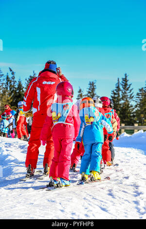 GERARDMER, FRANCE - FEB 20 - French children form ski school groups during the annual winter school holiday on Feb 20, 2015 in Gerardmer, France. Stock Photo