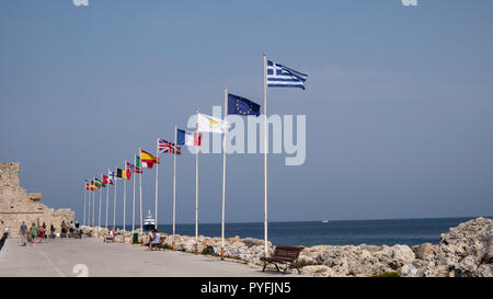 flags on the embankment at Rhodes Harbour Stock Photo