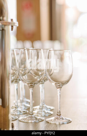 Clean beautiful glasses for alcohol on a table. Stock Photo