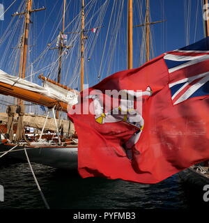 AJAXNETPHOTO. CANNES, FRANCE. - THREE LEGS OF MAN - RED ENSIGN FLAG OF THE ISLE OF MAN FLYING FROM STERN OF A YACHT MOORED IN THE OLD PORT. PHOTO:JONATHAN EASTLAND/AJAX REF:GX8 182509 618 Stock Photo