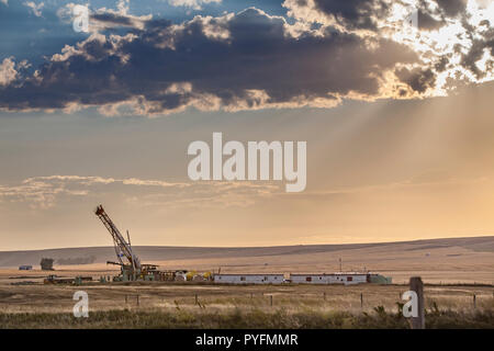 Slant drilling rig in Alberta Prairies. Stock Photo