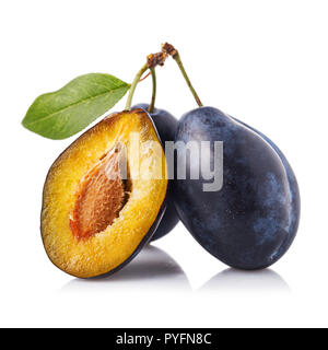 Useful fruits: three ripe prunes isolated on white background Stock Photo