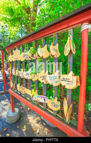 Kamakura, Japan - April 23, 2017: Ema praying tablets at Tsurugaoka Hachiman, the most important Shinto shrine built in 1063 in ancient Japan. Ema are small wooden plaques used for wishes. Stock Photo