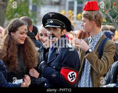 People seen wearing a zombie costumes and make-up attends the 'Zombie Walk Halloween 2018'  parade, in Kiev, Ukraine, 27 October 2018. Hundreds people marched through the streets  in downtown Kiev, on the eve the Halloween celebrations on October 31.   Hundreds of people marched through the streets in Kiev downtown, on the eve of the Halloween zombie celebrations. Stock Photo