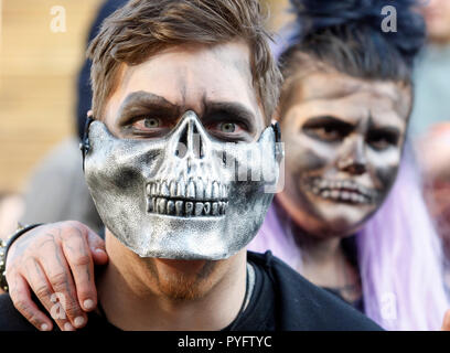 People are seen dressed in zombie costumes and make-up during the celebrations. Hundreds of people marched through the streets in Kiev downtown, on the eve of the Halloween zombie celebrations. Stock Photo