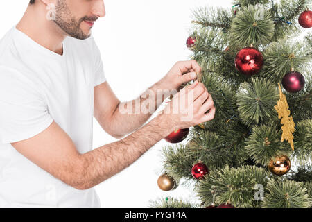 partial view of man decorating christmas tree isolated on white Stock Photo