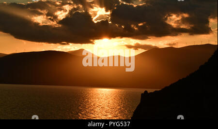 Nafplion, Greece. 27th October 2018. The sun sets in the city of Nafplion and makes toys with clouds creating an idyllic atmosphere, Saturday, 27 October 2018. Credit: VANGELIS BOUGIOTIS/Alamy Live News Stock Photo