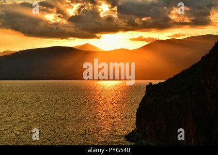 Nafplion, Greece. 27th October 2018. The sun sets in the city of Nafplion and makes toys with clouds creating an idyllic atmosphere, Saturday, 27 October 2018. Credit: VANGELIS BOUGIOTIS/Alamy Live News Stock Photo