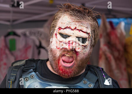 Poole, Dorset, UK. 27th October 2018. Poole's first ever zombie festival, a spook-tacular event and parade with prize for worst dress zombie. Crowds turn out on a really cold, but dry, day to take part or watch the chilling event. Credit: Carolyn Jenkins/Alamy Live News Stock Photo