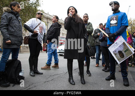 London, UK. 27th October, 2018. Lisa Cole, sister of Marc Cole, addresses campaigners from the United Families and Friends Campaign (UFFC) taking part in the 20th annual procession to Downing Street in remembrance of family members and friends who died in police custody, prison, immigration detention or secure psychiatric hospitals. Marc Cole, 30, died after being tasered by police called to reports of a man 'slashing himself' with a knife in Falmouth in May 2017. Credit: Mark Kerrison/Alamy Live News Stock Photo