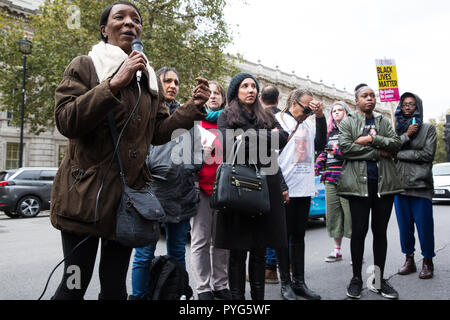 London, UK. 27th October, 2018. Marilyn Reed, mother of Sarah Reed, addresses campaigners from the United Families and Friends Campaign (UFFC) taking part in the 20th annual procession to Downing Street in remembrance of family members and friends who died in police custody, prison, immigration detention or secure psychiatric hospitals. Sarah Reed, 32, was found dead in a cell at Holloway prison on 11th January 2016. Credit: Mark Kerrison/Alamy Live News Stock Photo