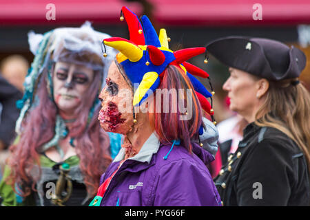 Poole, Dorset, UK. 27th October 2018. Poole's first ever zombie festival, a spook-tacular event and parade with prize for worst dress zombie. Crowds turn out on a really cold, but dry, day to take part or watch the chilling event. Credit: Carolyn Jenkins/Alamy Live News Stock Photo