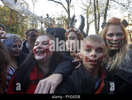 Kiev, Kiev, Ukraine. 27th Oct, 2018. People are seen dressed in zombie costumes and make-up during the celebrations.Hundreds of people marched through the streets in Kiev downtown, on the eve of the Halloween zombie celebrations. Credit: Pavlo Gonchar/SOPA Images/ZUMA Wire/Alamy Live News Stock Photo