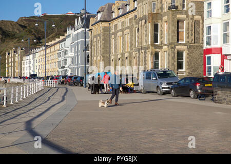 Aberystwyth,UK,27th October 2018,People enjoy the Glorious warm Autumn sunshine over Aberystwyth in Wales as temperatures are much chillier as high pressure has brought colder air from the North.Credit: Keith Larby/Alamy Live News Stock Photo