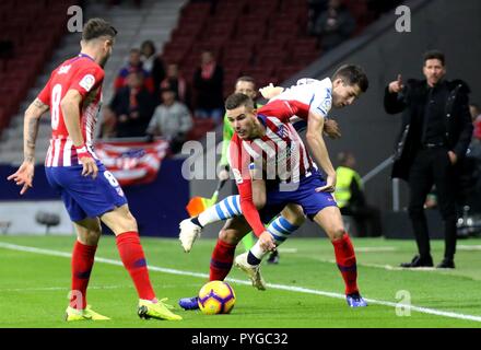 Madrid, Spain. 27th Oct, 2018. Atletico Madrid's Lucas Hernandez (2nd L) vies for the ball during the Spanish La Liga soccer match between Atletico Madrid and Real Sociedad in Madrid, Spain, Oct. 27, 2018. Atletico Madrid won 2-0. Credit: Edward Peters Lopez/Xinhua/Alamy Live News Stock Photo