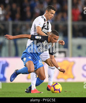 Empoli. 27th Oct, 2018. Juventus's Cristiano Ronaldo (back) vies with Empoli's Ismael Bennacer during the 2018-2019 Serie A soccer match between FC Juventus and Empoli in Empoli, Italy, Oct.27, 2018. FC Juventus won 2-1. Credit: Alberto Lingria/Xinhua/Alamy Live News Stock Photo