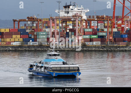 Vancouver, British Columbia, Canada. 26th Oct, 2018. The SeaBus passenger ferry '' Burrard Pacific Breeze '' passes by the Port of Vancouver's Centerm container facility on its way to Waterfront station. The transit service links North Vancouver with downtown Vancouver. Credit: Bayne Stanley/ZUMA Wire/Alamy Live News Stock Photo