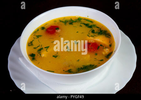 Fish soup with salmon and tomato - Uha Stock Photo