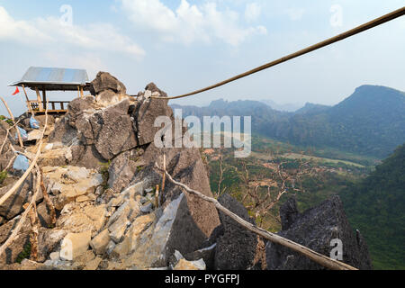 Scenic view of a shelter on top of the rocky Phangern (Pha Ngern, Pha ngeun) Mountain and area near Vang Vieng in Laos on a sunny day. Stock Photo