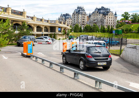 Kazan, Russia - June 12, 2018: Automatic rising arm barrier for entry or stop traffic at the car parking. Boom Barrier Stock Photo