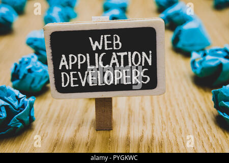 Handwriting text writing Web Application Developers. Concept meaning Internet programming experts Technology software Stand blackboard with white word Stock Photo