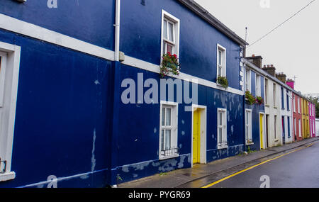 brightly colored painted homes and doors on a street in Dingle, Kerry, Ireland Stock Photo