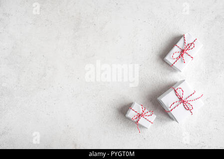 Christmas Gift Boxes in white background, copy space. White Christmas Gifts, winter festive composition, concept. Stock Photo