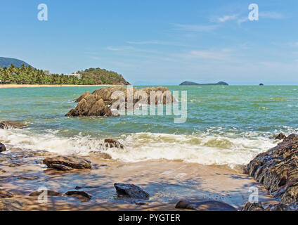 The scenic Trinity Beach from the south end looking northward towards Palm Cove in the Coral Sea. Stock Photo