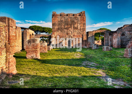 Archaeological Roman empire landscape in Ostia Antica with a view of the back of the Capitolium - Rome Stock Photo