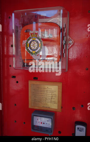 defribillator in classic phonebox, Ticehurst United Kingdom Stock Photo