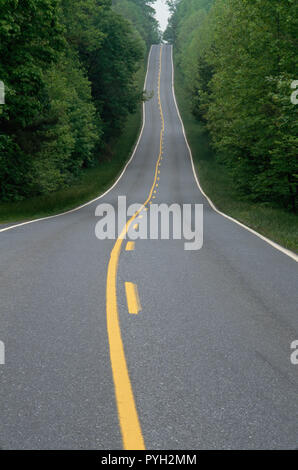 Two lane country road extends over the next hill, Virginia, USA Stock ...