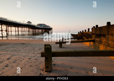 Cromer Pier and protective groynes, Norfolk, England, UK Stock Photo