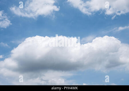 Large Cumulus cloud is floating on the blue sky in summer time. Stock Photo