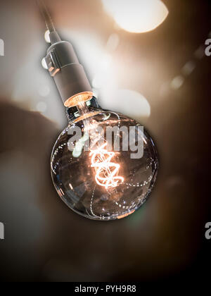 vintage lightbulb with dark background and lens flares Stock Photo