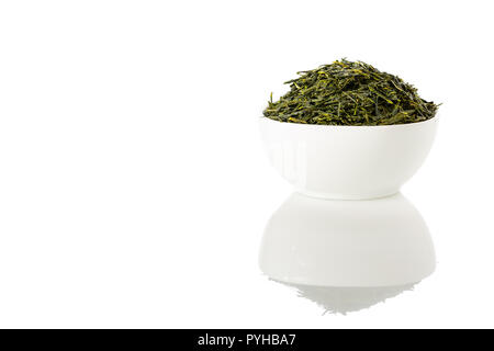Green sencha tea in white cup isolated on white background. Stock Photo