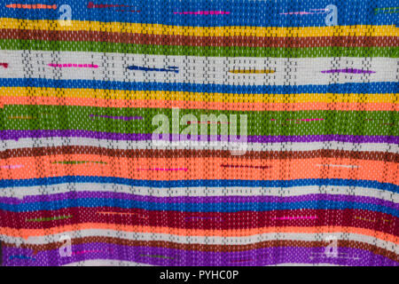 bright background with woven surface handmade and colourful textile strips Stock Photo