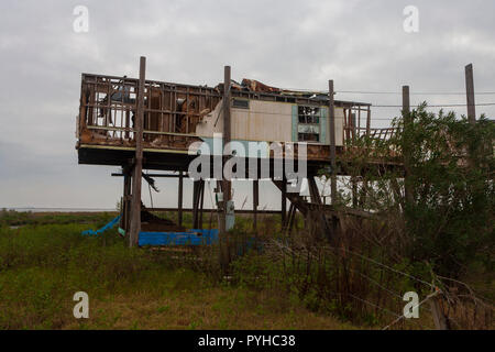 The community on the Isle de Jean Charles has suffered due to environmental impact from years of hurricanes and saltwater erosion. Stock Photo