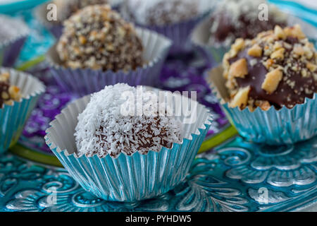 Homemade chocolate truffles each in its own foil cup. A Christmas favourite. Stock Photo