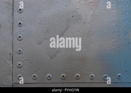 Old aluminum background detail of a military aircraft, surface corrosion. Stock Photo