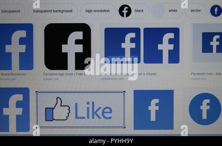 Google page on computer screen shows multiple Facebook logos Stock Photo