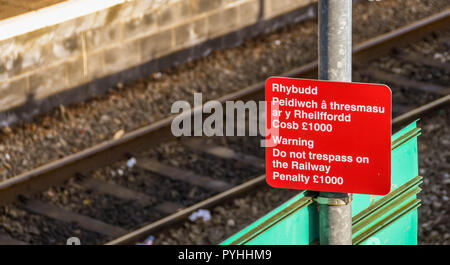 MOUNTAIN ASH, WALES - OCTOBER 2018: Close up view of a warning sign on a platform at Mountain Ash railway station. Stock Photo