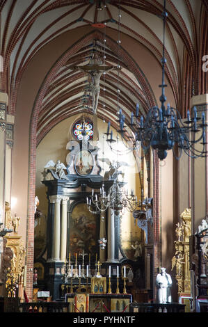 Main altar, Crucifix, galeri hats and Papal tiara in Gothic Archcathedral Basilica of the Assumption of the Blessed Virgin Mary and Saint Andrew, From Stock Photo