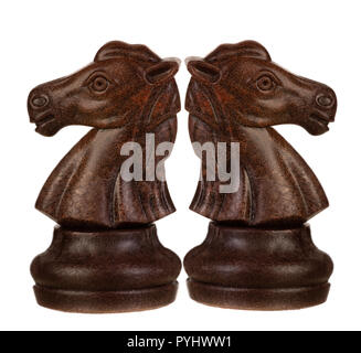 Brown and white knights back to back. Symmetrical pieces of chess Stock Photo