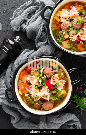 Italian minestrone soup with beef meatballs, vegetables and pasta in bowl Stock Photo