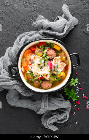 Italian minestrone soup with beef meatballs, vegetables and pasta in bowl Stock Photo