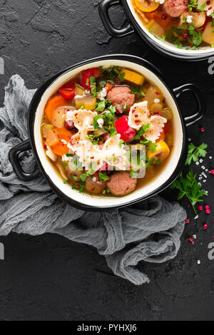 Italian minestrone soup with beef meatballs, vegetables and pasta in bowl Stock Photo