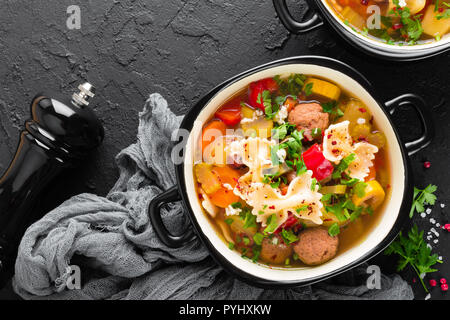 Italian minestrone soup with beef meatballs, vegetables and pasta in bowl Stock Photo