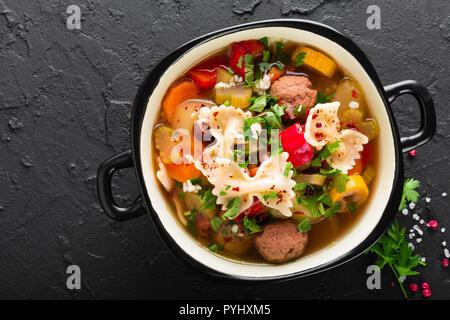 Italian minestrone soup with beef meatballs, vegetables and pasta in bowl Stock Photo