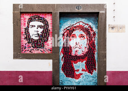Murals on a building in Camara de Lobos, Madeira. Made from cut cans of  beverages Jesus and Che Guevara Stock Photo